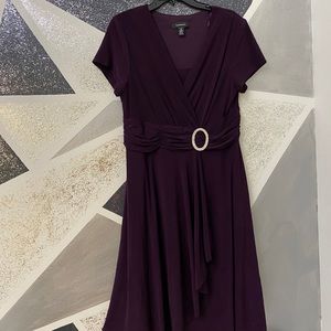 Dark purple dress with diamond brooch